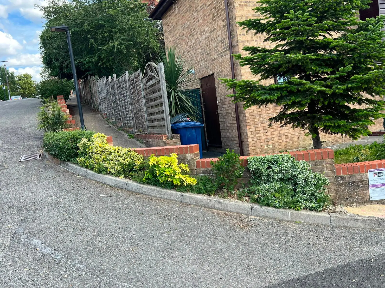 Front garden and shrubs kept tidy on the corner of a residential estate