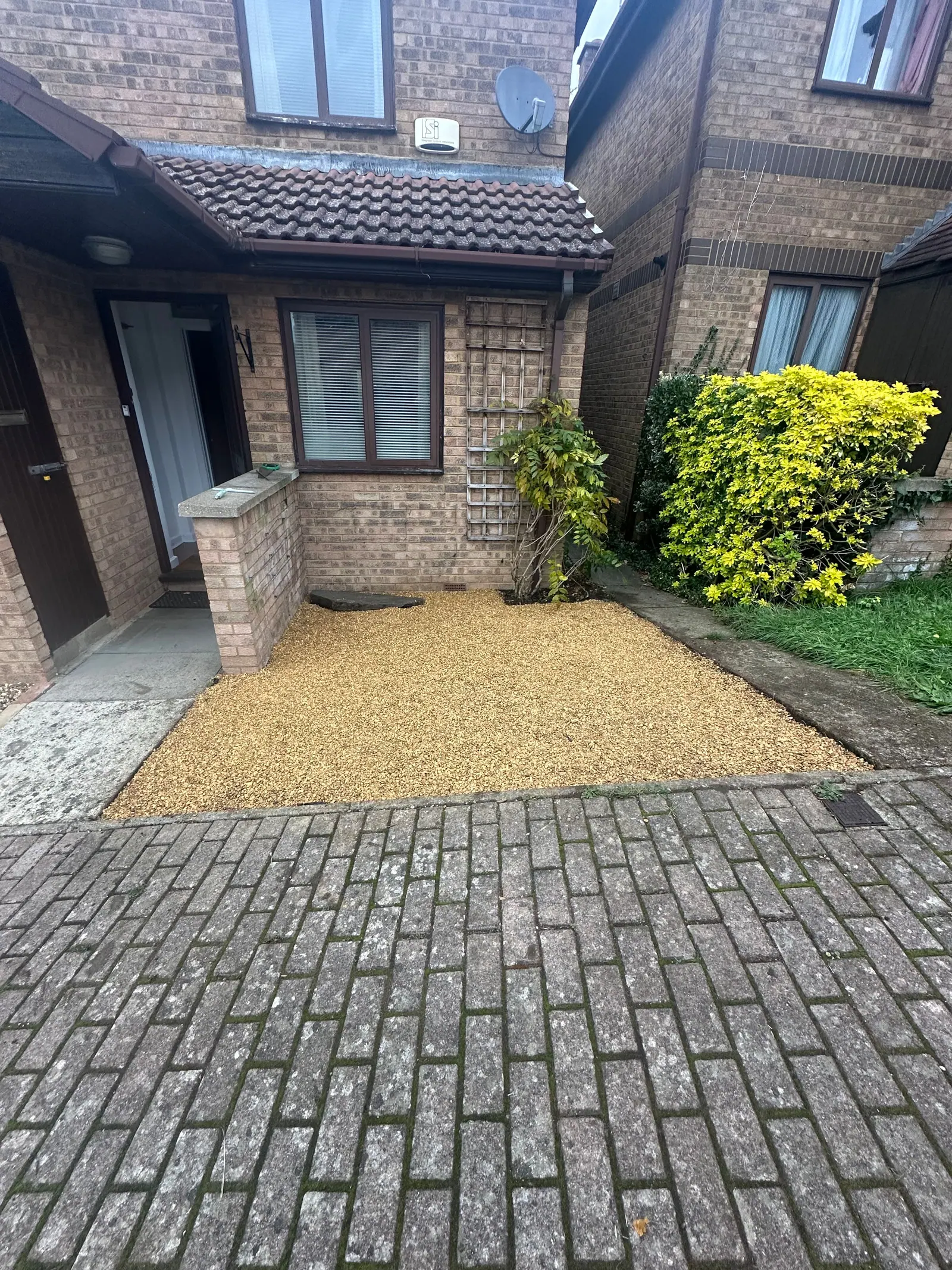 Front garden tidied with a new gravel bed next to block paving